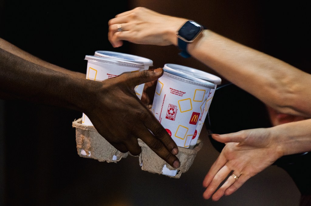 An employee of an McDonald by delivering food to a client in a car in Houston, Texas on July 28, 2021